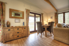 view of the open-plan lounge and dining area at Waldon Valley self catering lodge in devon
